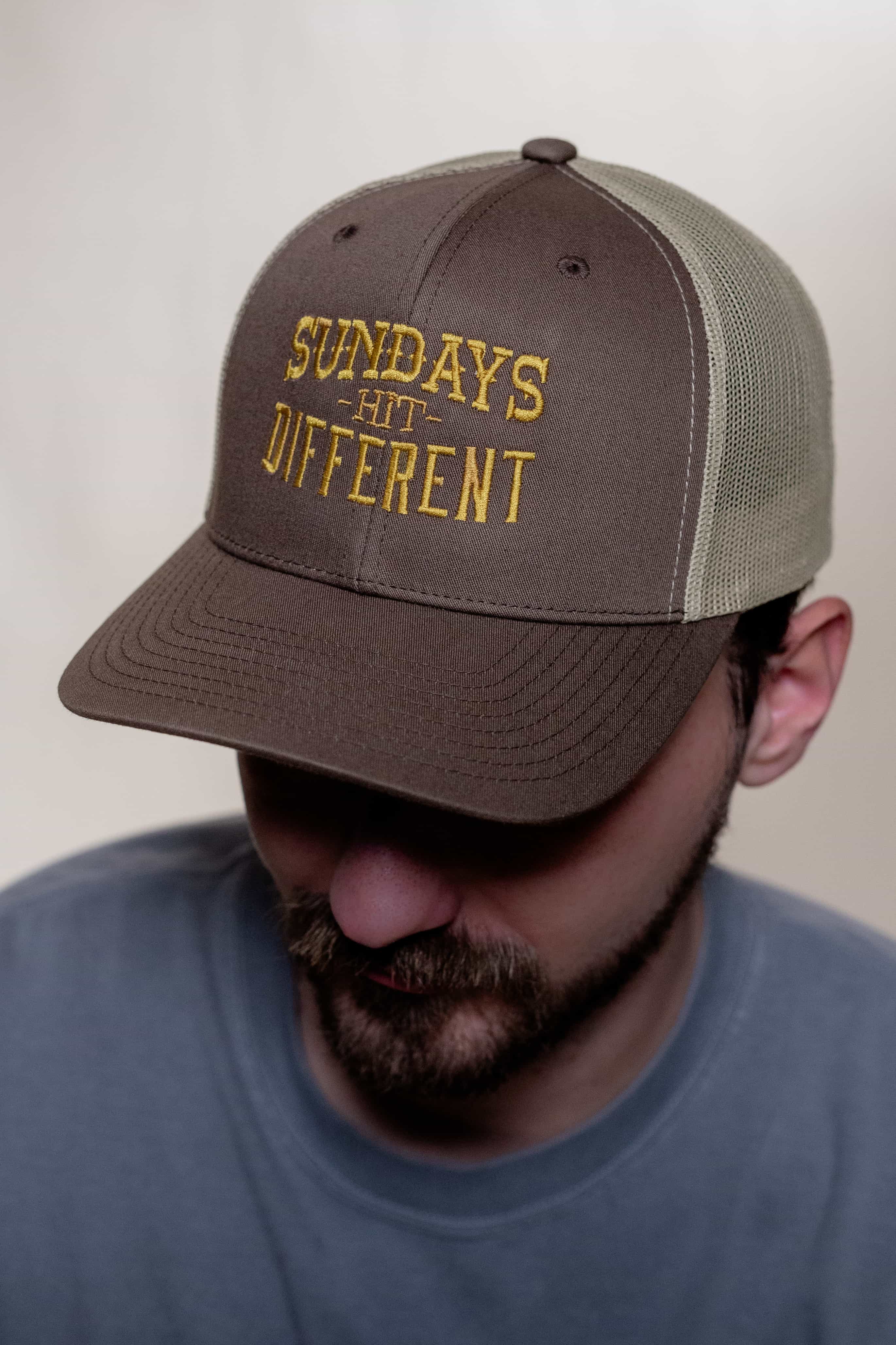 Sundays Hit Different Trucker Hat featuring brown and beige colors from Religious Shirt Company, Christian Shirts Shop.