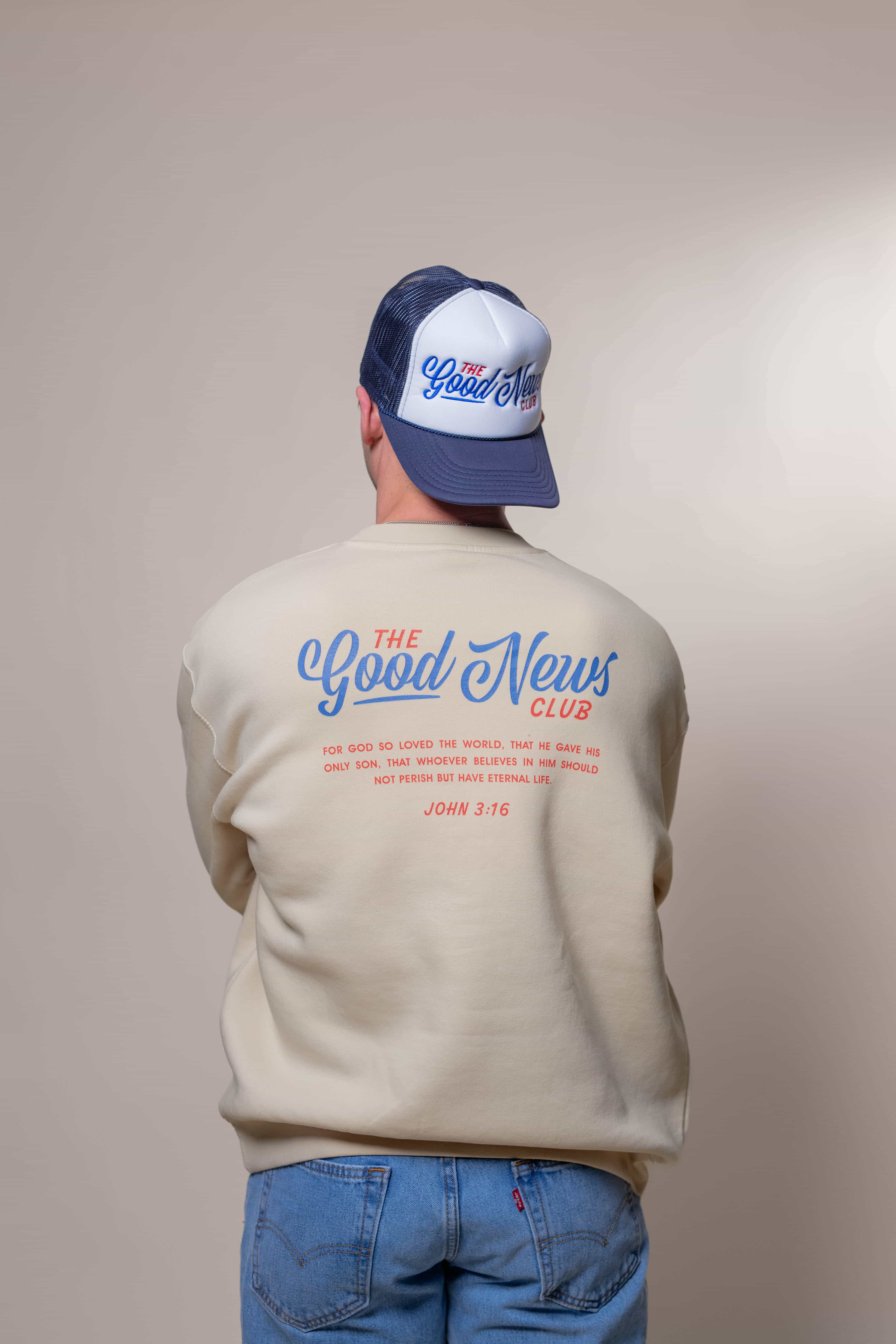 Sweatshirt from Faith based Christian company, Christian Shirts Shop. 
Graphic: The Good News Club John 3:16
Color: Cream Sweatshirt with red and blue graphics
Brand: Lane Seven