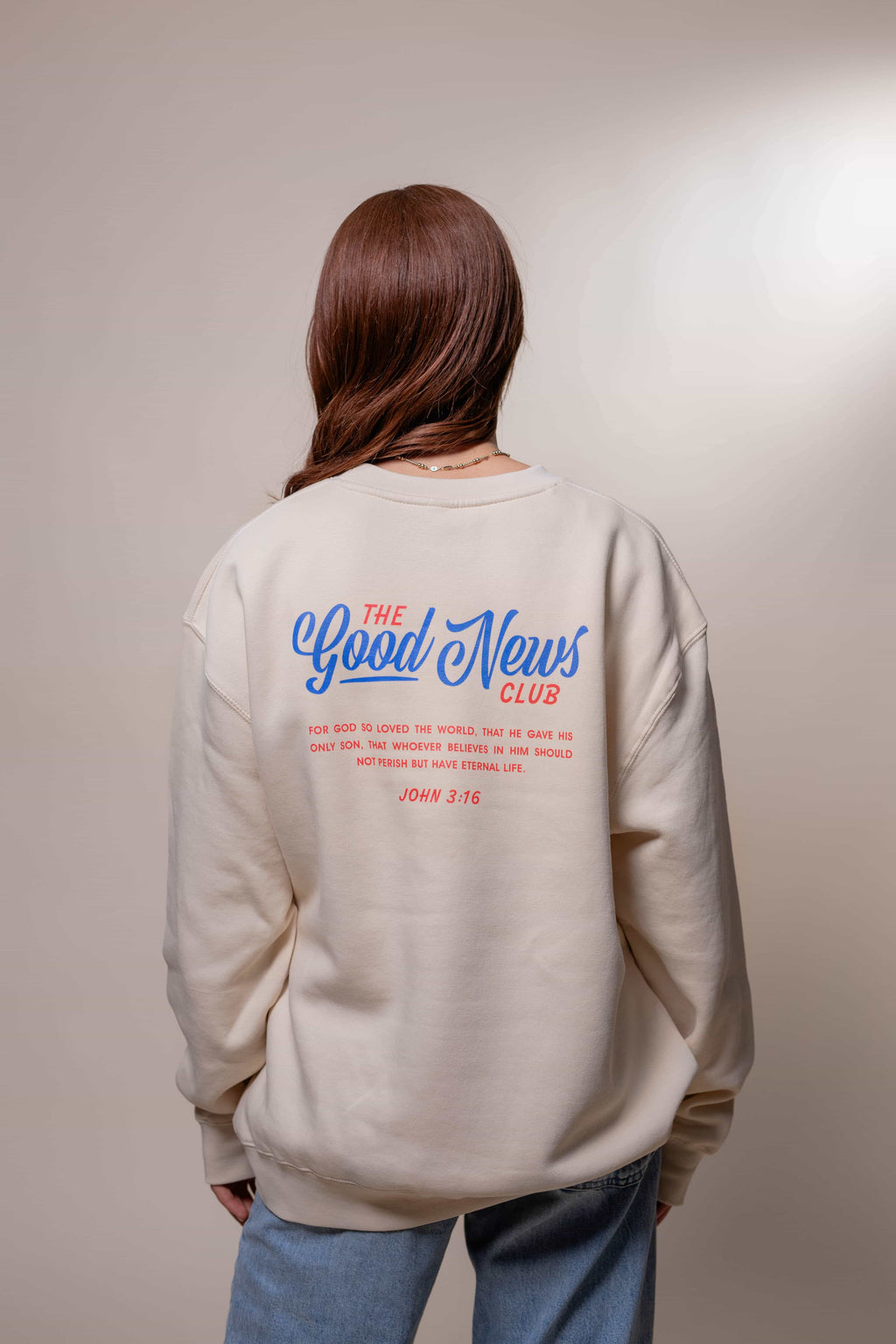 Sweatshirt from Faith based Christian company, Christian Shirts Shop. 
Graphic: The Good News Club John 3:16
Color: Cream Sweatshirt with red and blue graphics
Brand: Lane Seven