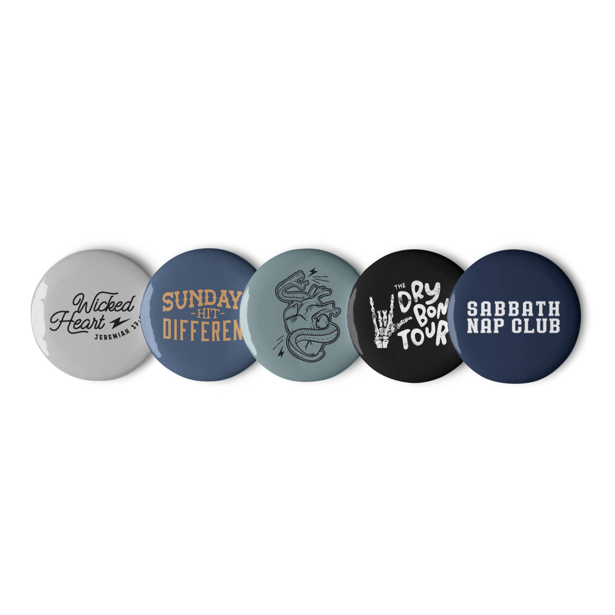 Set of 5 Religious Pin Buttons with graphics from faith based Christian company, Christian Shirts Shop shirt collections. Graphics included are Wicked Heart verse, Sundays Hit Different, Wicked Heart Serpent, The Dry Bones Tour, and Sabbath Nap Club.