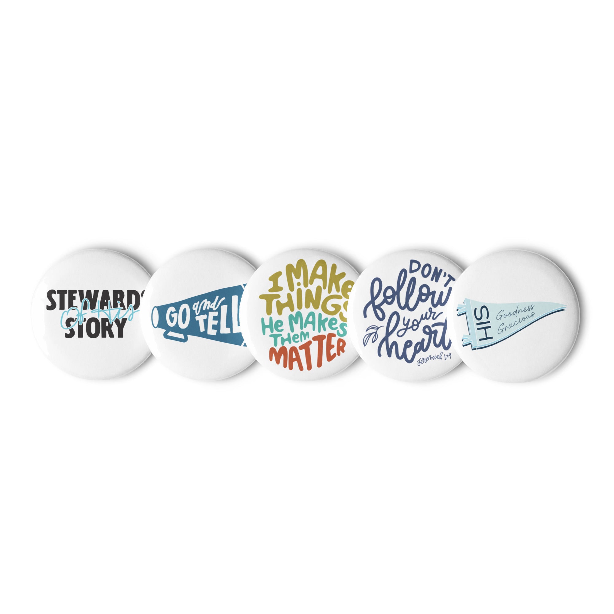 Set of 5 Pin Buttons with graphics from faith based Christian company, Christian Shirts Shop shirt collections. 
Graphics included are Stewards of His Story, Go and Tell, I make things - He makes them matter, Don't Follow Your Heart, and His Goodness Gracious.